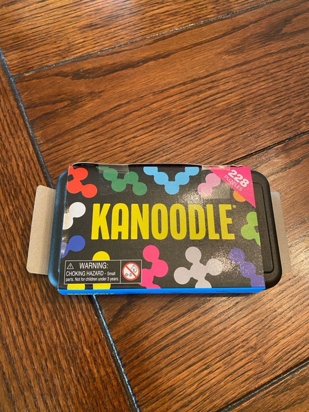 Kanoodle Puzzle Game Tin - Multicolor